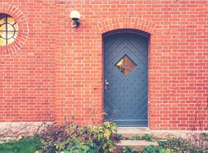 iron door on a redbrick walls