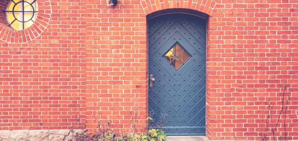 iron door on a redbrick walls
